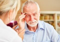 Senior,With,Dementia,Or,Alzheimer's,Is,Comforted,By,Caring,Female Senior,With,Dementia,Or,Alzheimer's,Is,Comforted,By,Caring,Female